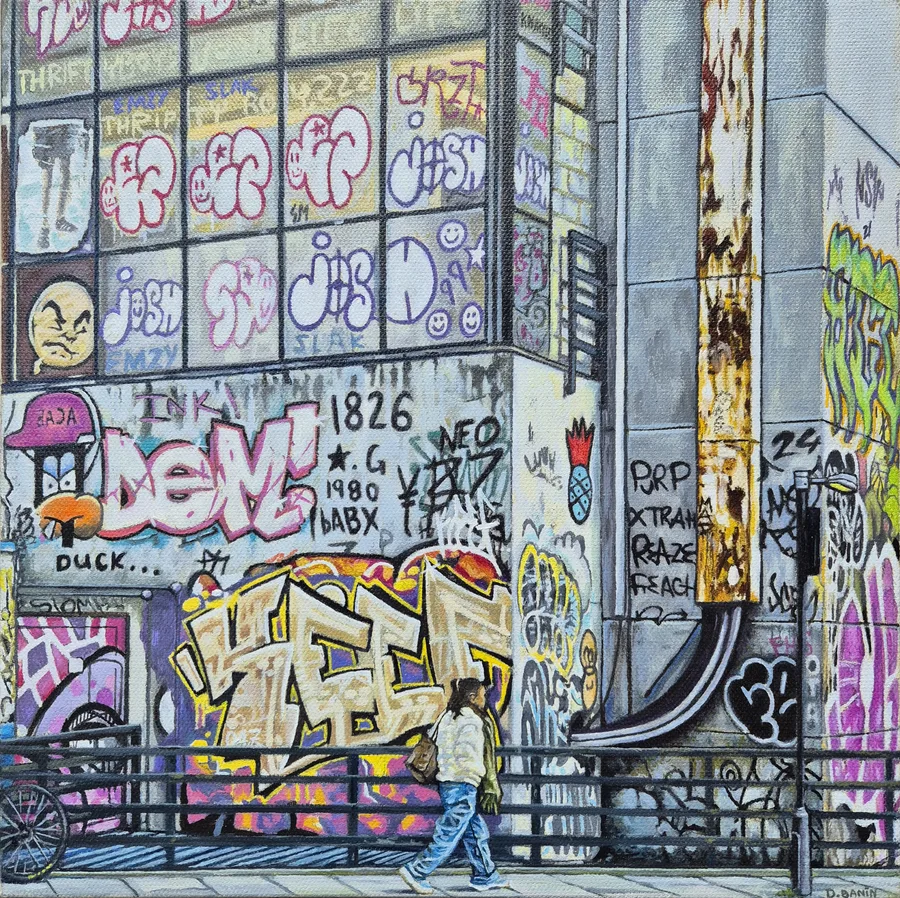 A pedestrian walking beneath a graffiti-covered city building in Gaze Below by Daniel Banin